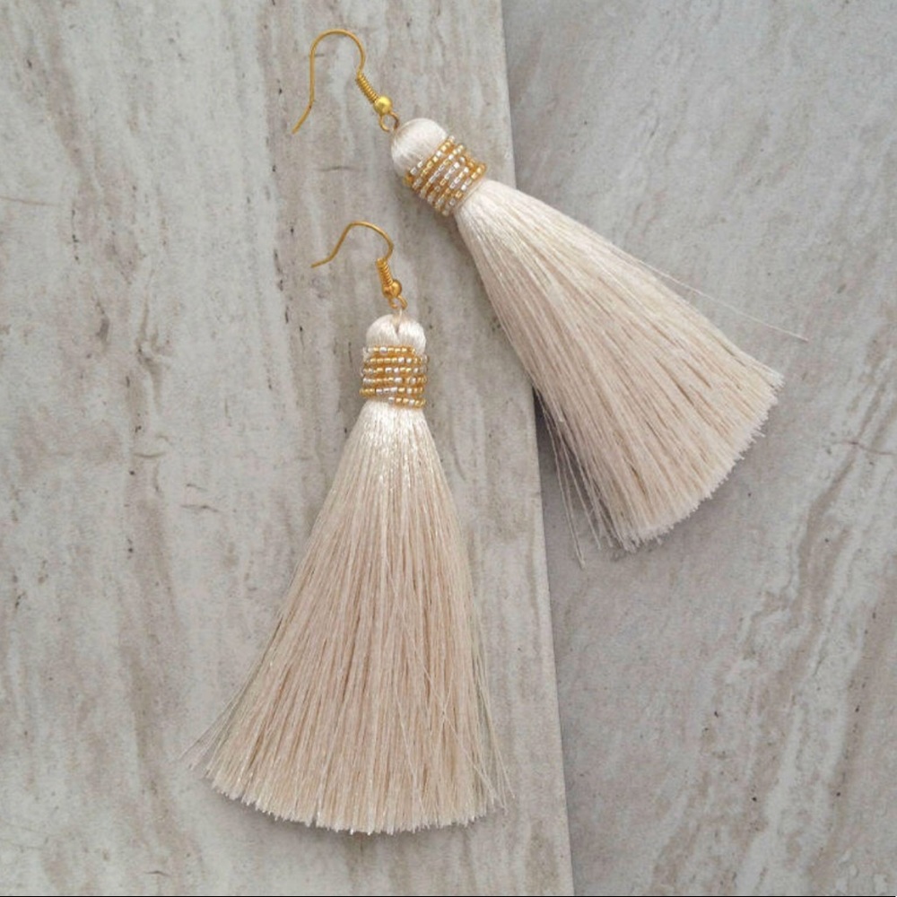 Tassel cream earrings with gold bead accents